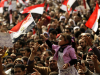 A girl waves the Egyptian national flag as thousands of demonstrators participate in antigovernment protests, February 8, 2011. Photo: Felipe Trueba / EPA / Thinking Images v.9