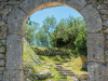 A photograph of a stone path running up the side of a rustic hill