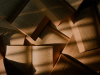 A photograph of a number of books open in a pile on a desk ribboned with shadow