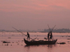 Fishermen work before dawn on the coast off of Kerala