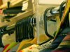 A close-cropped shot of a row of costumes on hangers in a long row. The focus is on the hangers.