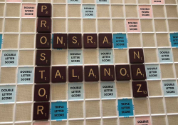 A photograph of a Scrabble board populated by non-English words