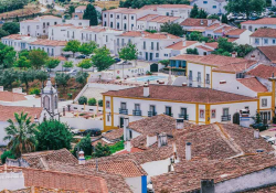 An aerial photograph of a neighborhood in Óbidos, Portugal