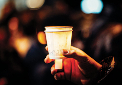 Vigil with candles in paper cups